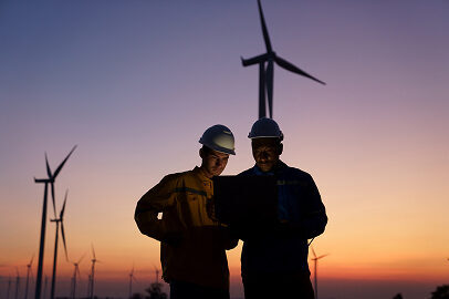 workers near wind turbines